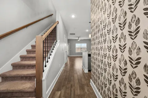 a view of an entryway with wooden floor