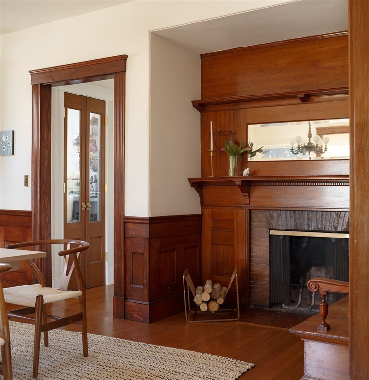 25 Barrington Road Boston, MA 02124 - Photo 14 of 33 a living room with furniture and a fireplace