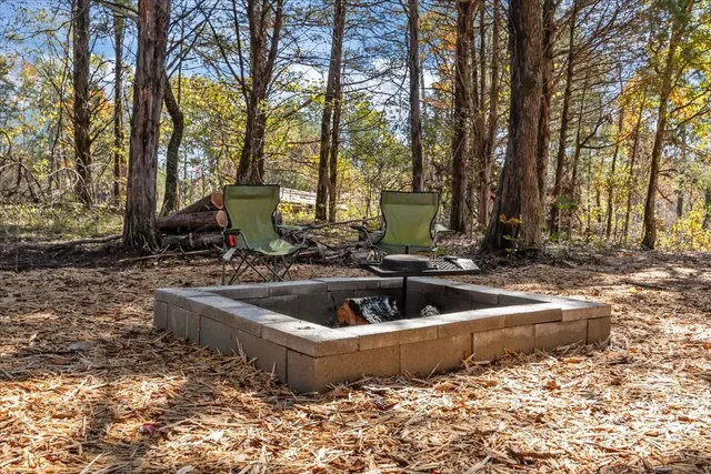 a view of a dining room with furniture and window