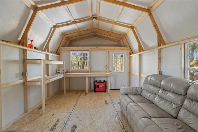 a view of a yard with large trees