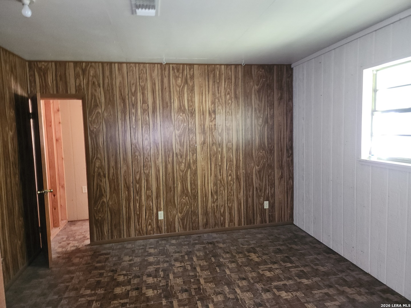 235 North 12th Street Junction, TX 76849 - Photo 6 of 14 an empty room with windows