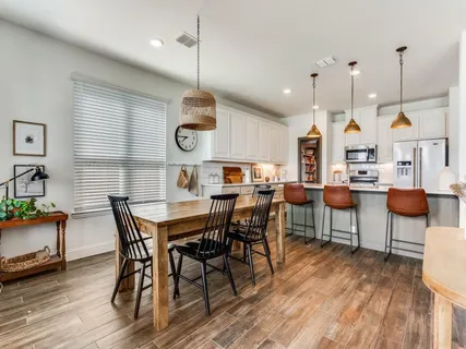 a view of a dining area with furniture and wooden floor