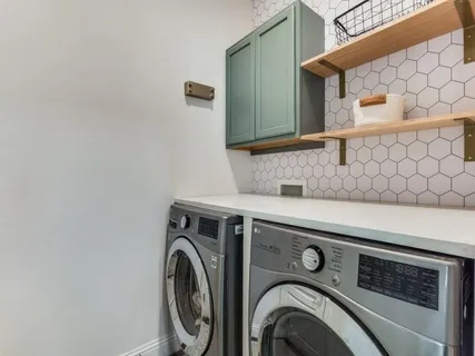 a view of hallway with stairs and furniture