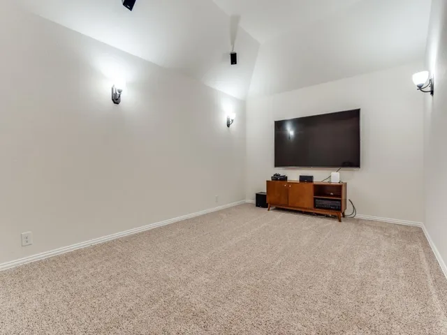 a view of a livingroom with furniture and a flat screen tv