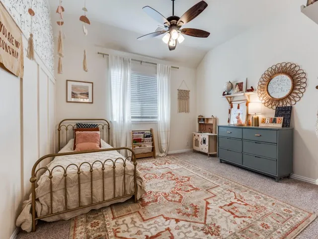 a bedroom with furniture and a chandelier