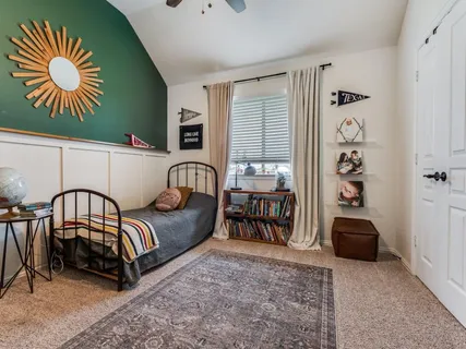 a bathroom with a double vanity sink mirror and bathtub