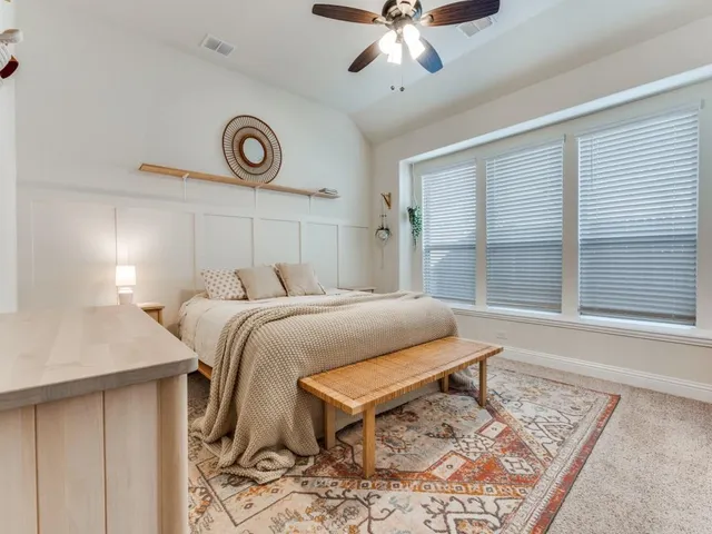 a en suite bathroom with a sink and a mirror