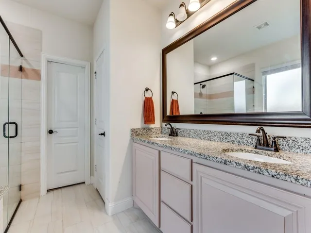 a bathroom with a bathtub and shower