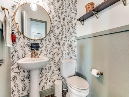 a view of a house with a backyard and porch