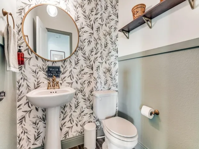 a view of a house with a backyard and porch