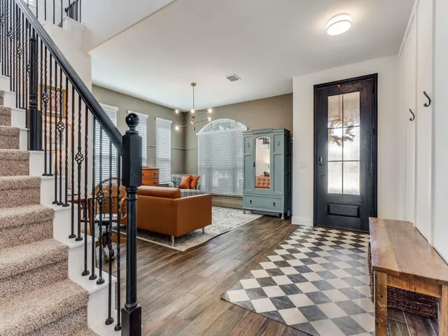 a living room with furniture and a table