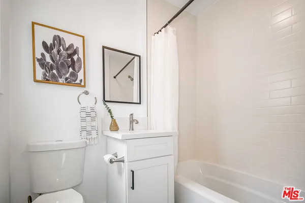 a bathroom with a toilet a sink and a bathtub