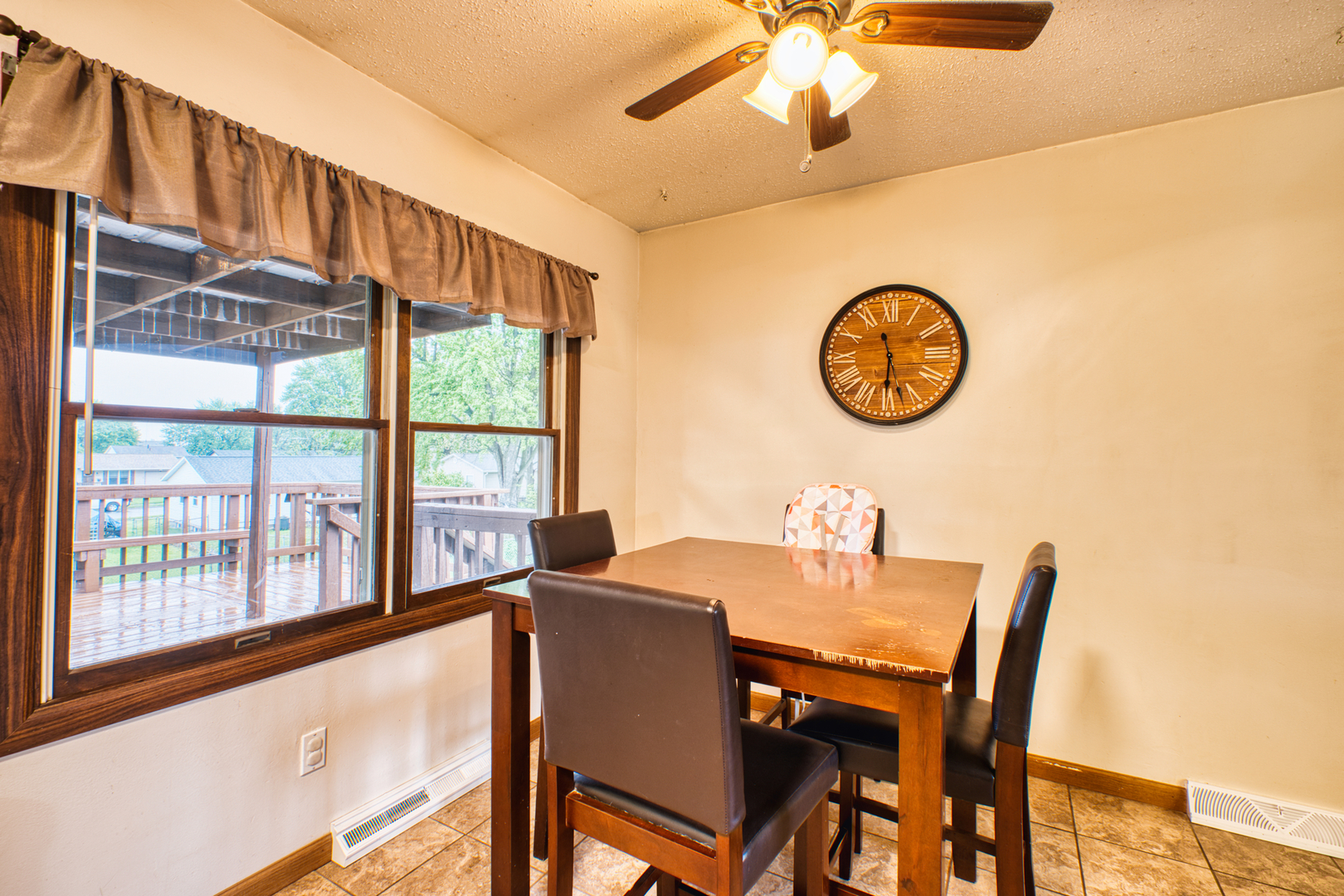 2313 Lafayette Terrace Clinton, IA 52732 - Photo 13 of 39 a view of a dining room with furniture window and wooden floor