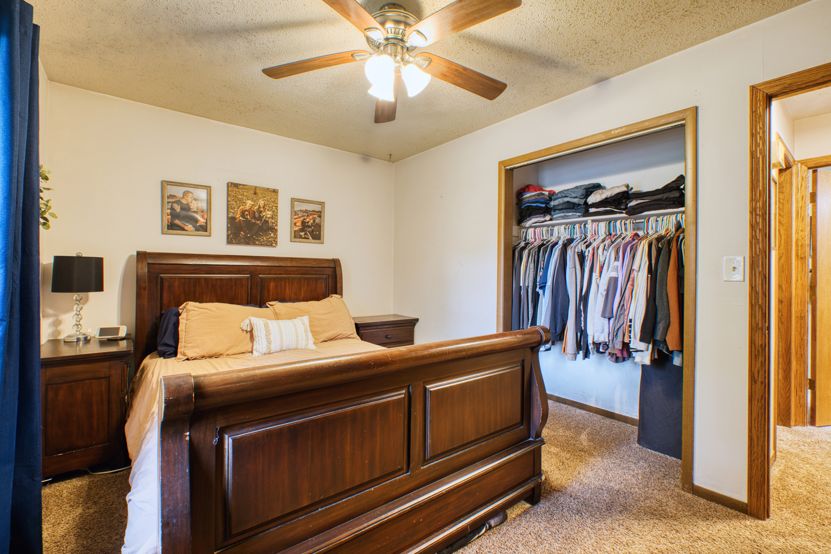 2313 Lafayette Terrace Clinton, IA 52732 - Photo 15 of 39 a bedroom with a bed and a chandelier