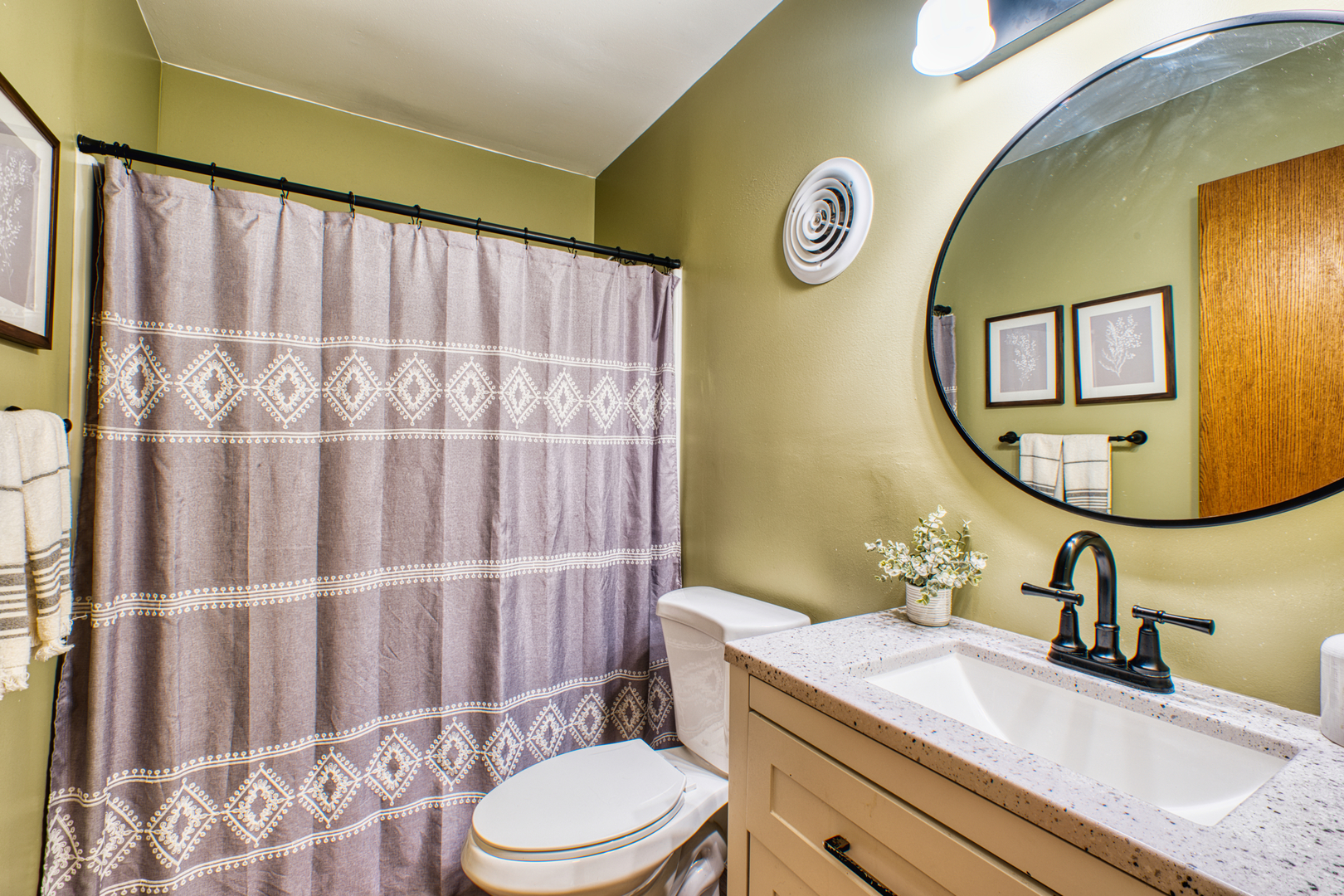 2313 Lafayette Terrace Clinton, IA 52732 - Photo 20 of 39 a bathroom with a sink and a mirror
