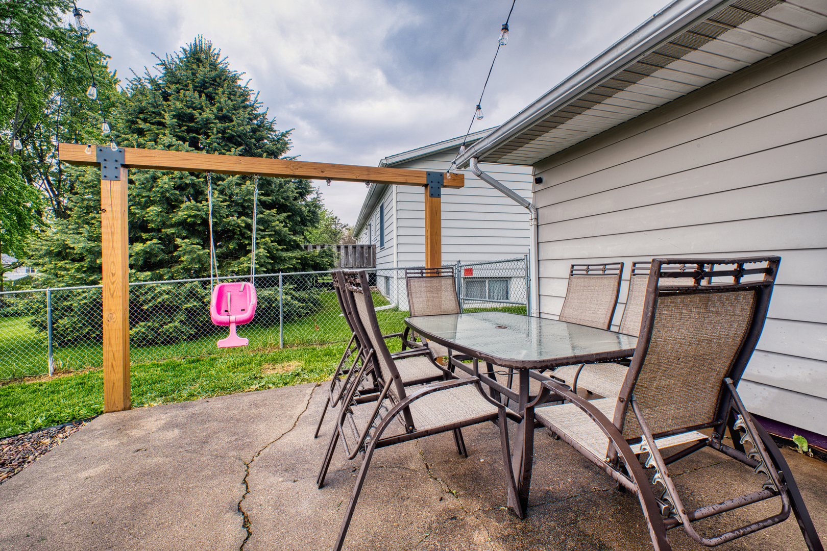 2313 Lafayette Terrace Clinton, IA 52732 - Photo 35 of 39 a backyard of a house with table and chairs