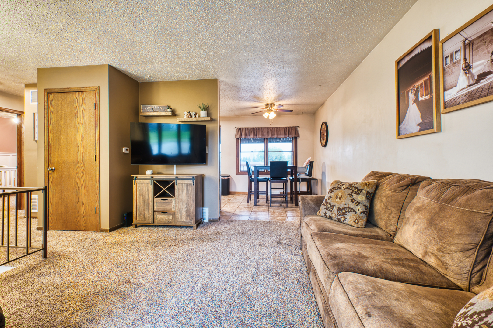 2313 Lafayette Terrace Clinton, IA 52732 - Photo 6 of 39 a living room with furniture and a flat screen tv