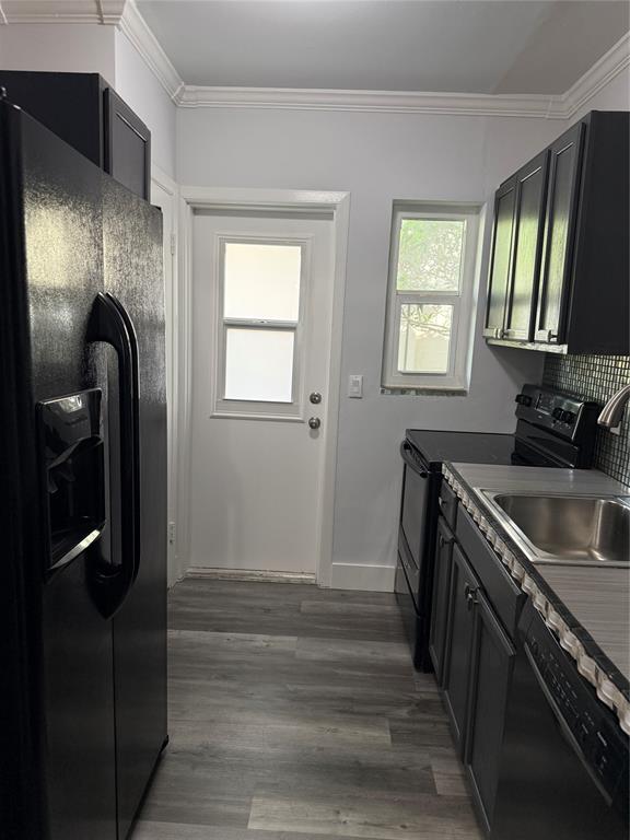 2121 Northeast 42nd Court, Unit 103C Lighthouse Point, FL 33064 - Photo 10 of 31 a kitchen with stainless steel appliances granite countertop a sink a stove and a refrigerator