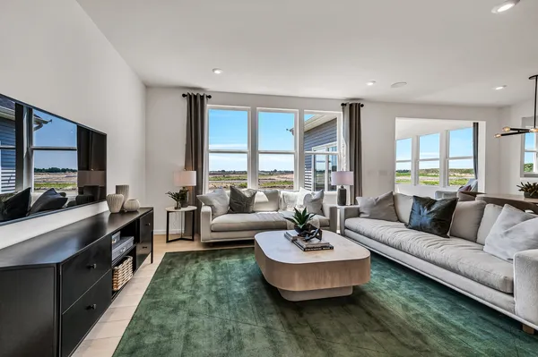 a living room with fireplace furniture and a flat screen tv