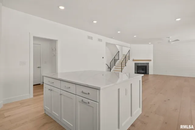 a kitchen with sink cabinets and microwave