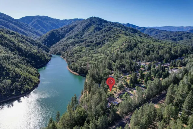 a view of a lush green hillside and a building