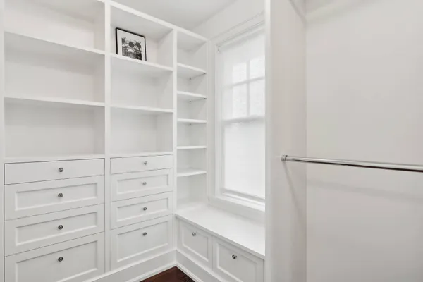 a view of an empty walk in closet