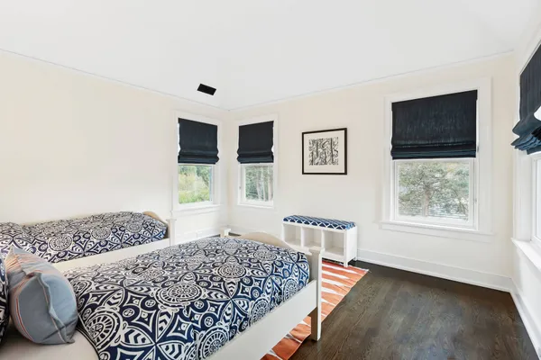 a bedroom with furniture and windows
