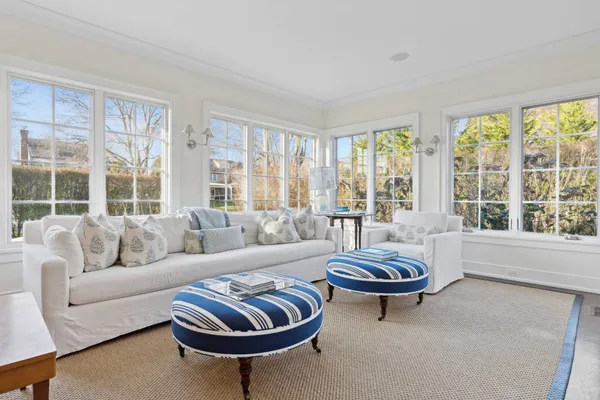 a living room with furniture a large window and a large window
