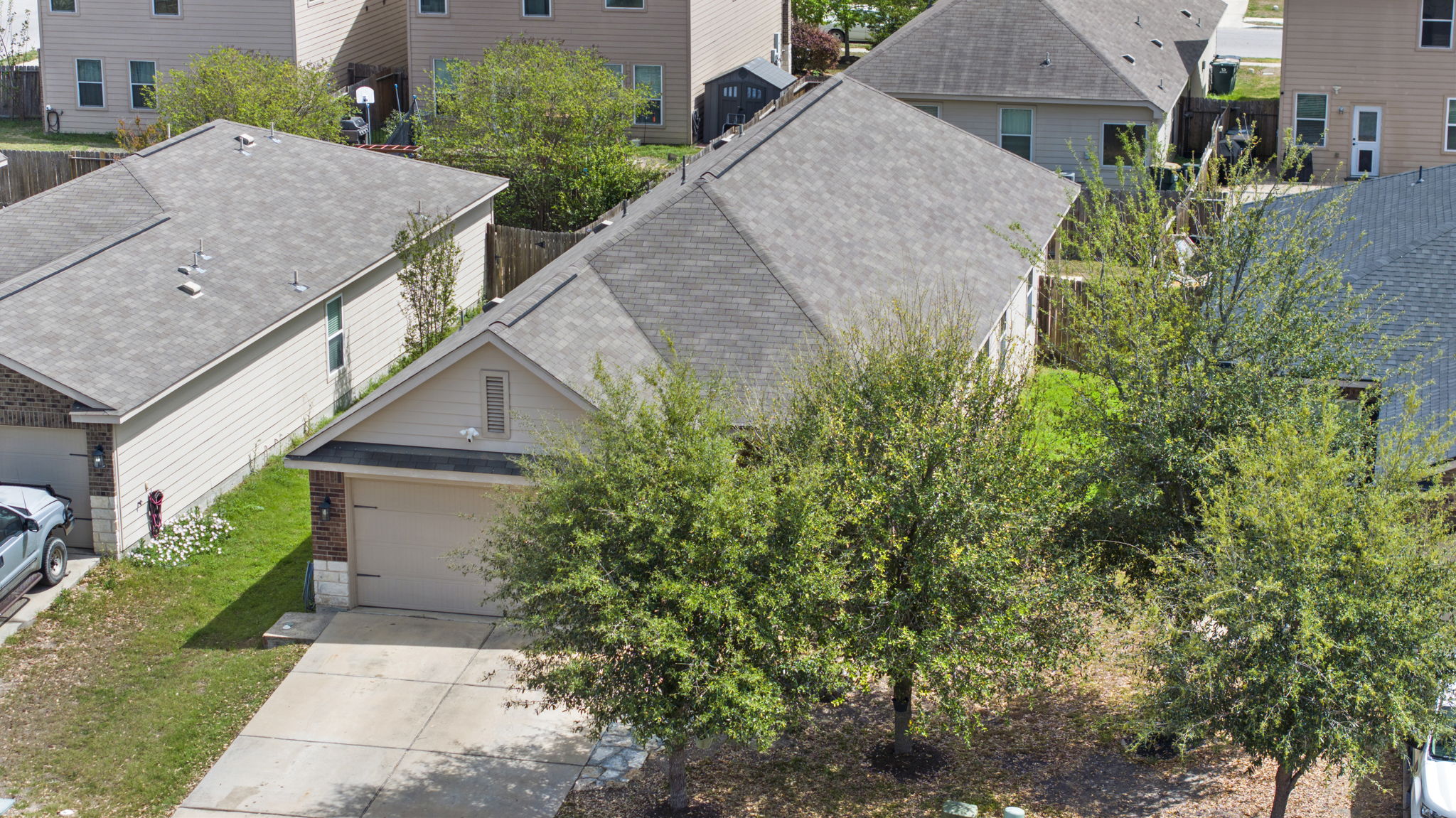 1617 Treeta Trail Kyle, TX 78640 - Photo 12 of 39 an aerial view of house with yard and trees in the background