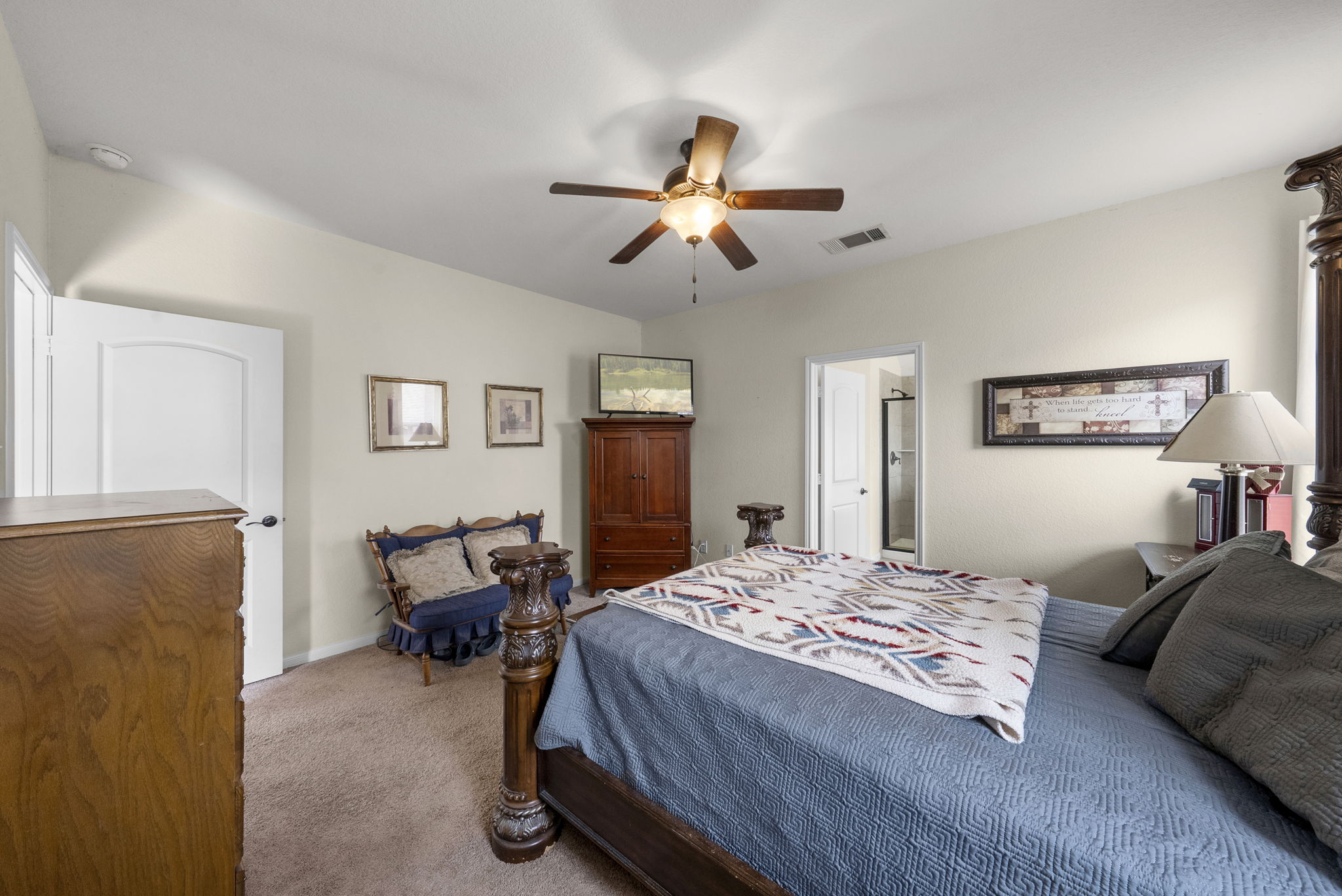 1617 Treeta Trail Kyle, TX 78640 - Photo 28 of 39 a bedroom with a bed and wooden floor