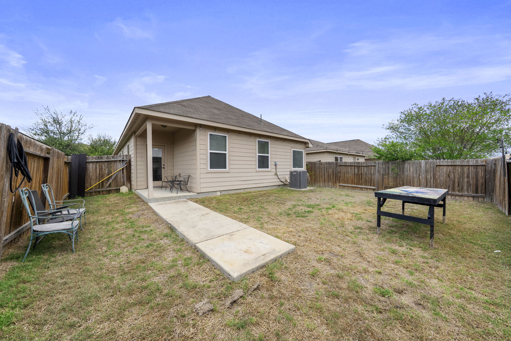 1617 Treeta Trail Kyle, TX 78640 - Photo 34 of 39 a view of a house with backyard and sitting area