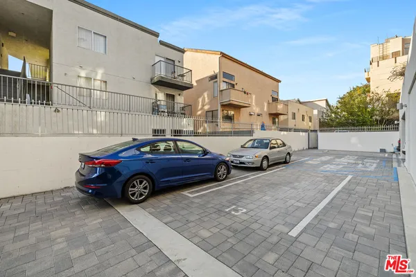 a view of a car parked in front of a building
