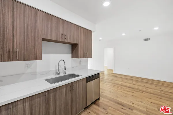 a kitchen with a sink and cabinets
