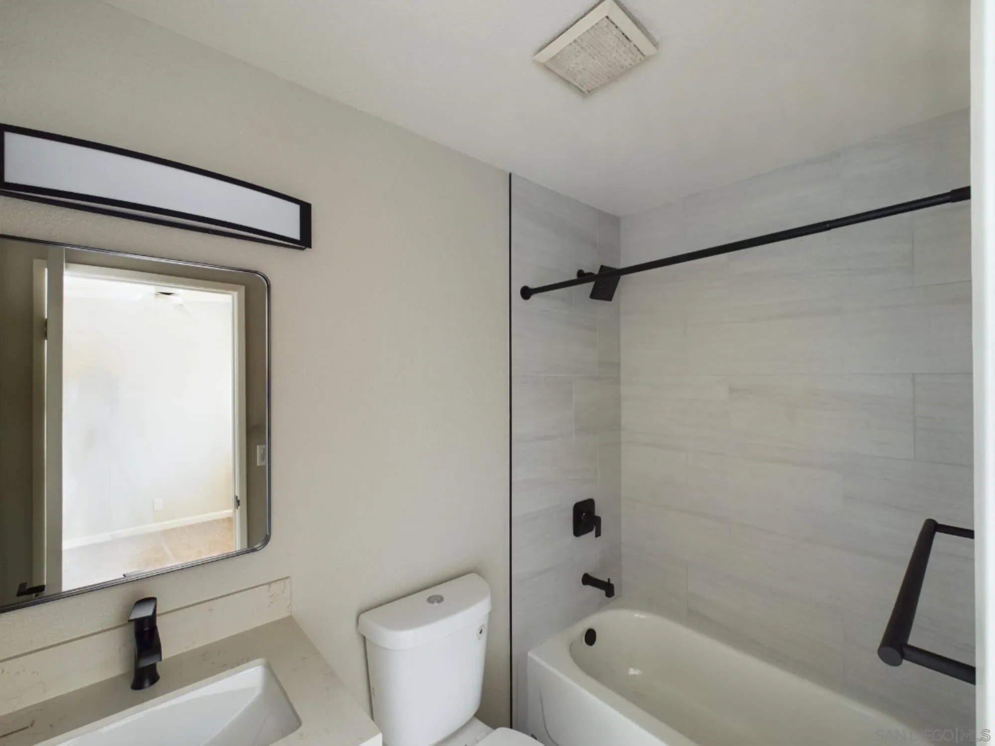 185 Saxony Road Encinitas, CA 92024 - Photo 14 of 14 a bathroom with a bathtub a toilet and a shower