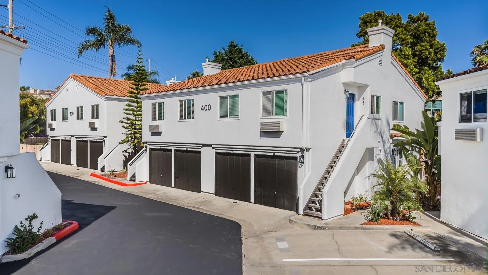 185 Saxony Road Encinitas, CA 92024 - Photo 5 of 14 a front view of a house with a yard
