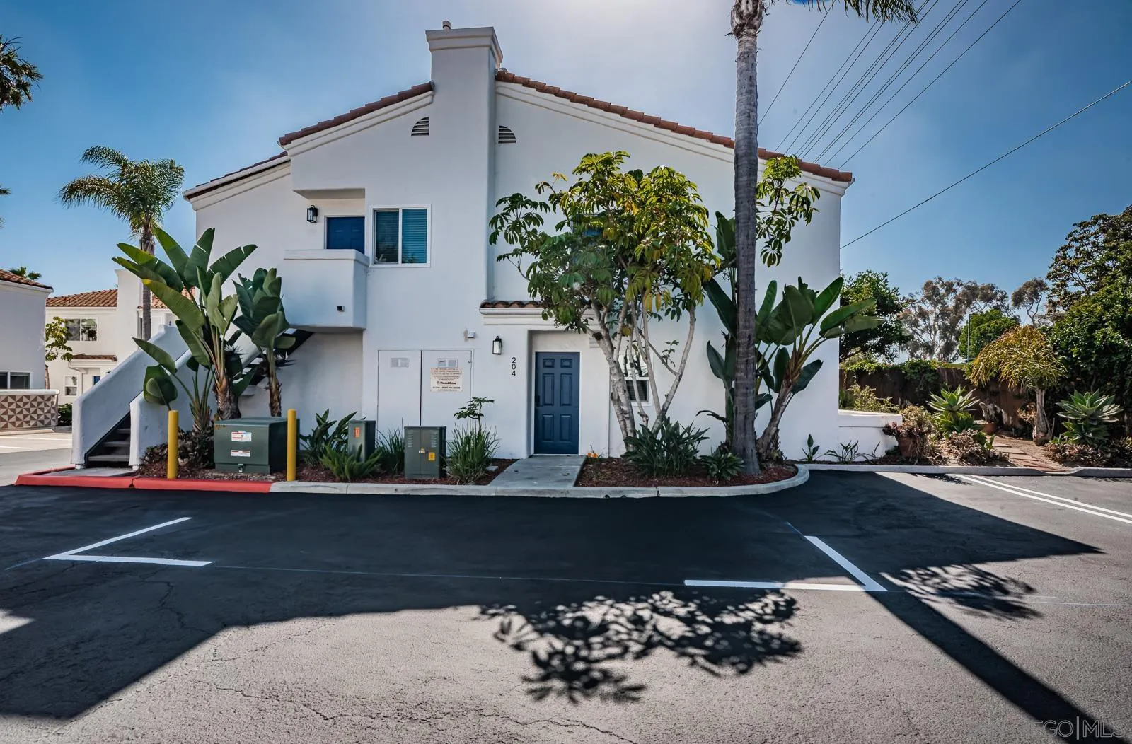 185 Saxony Road Encinitas, CA 92024 - Photo 8 of 14 a front view of a house with a yard