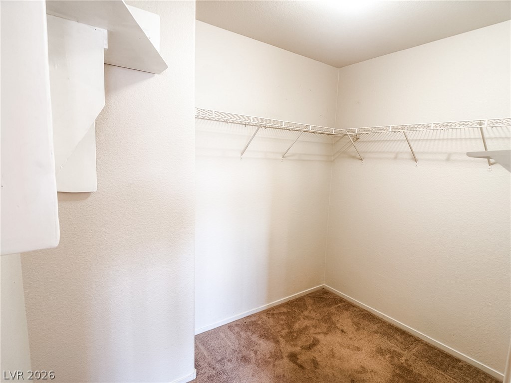 228 Positive Point Street Henderson, NV 89012 - Photo 19 of 27 Ample shelving and hanging space defines this practical, organized closet.