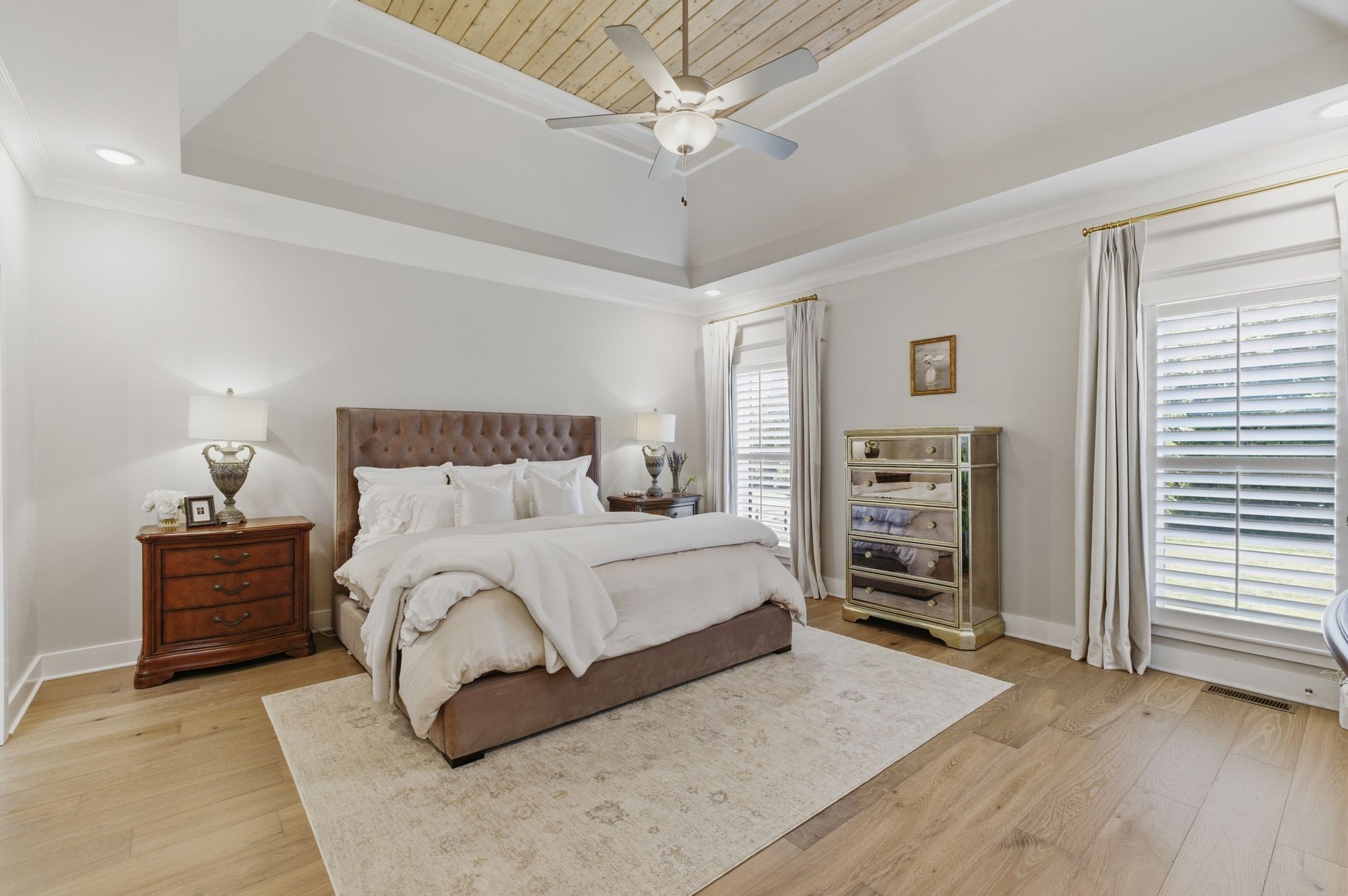 17845 Highway 76 East Springfield, TN 37172 - Photo 27 of 55 a bedroom with a large bed and a chandelier