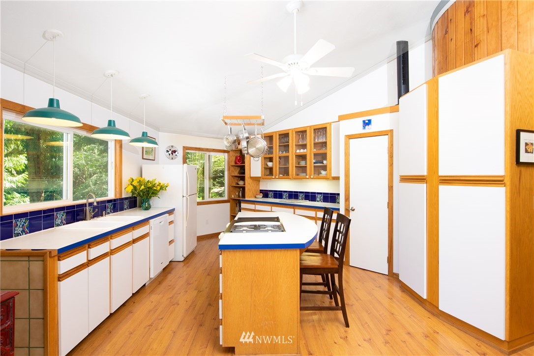 3625 Green Cliffs Road Anacortes, WA 98221 - Photo 14 of 26 a kitchen with stainless steel appliances granite countertop a stove and a refrigerator