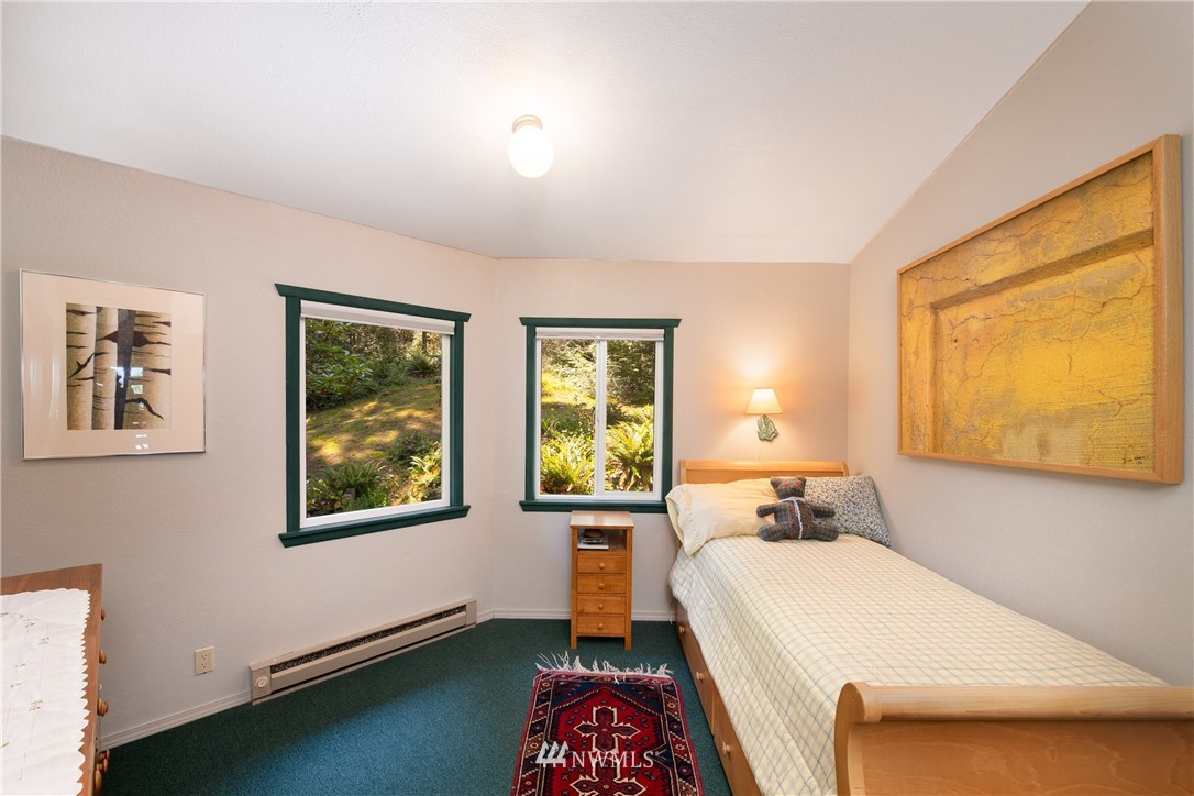 3625 Green Cliffs Road Anacortes, WA 98221 - Photo 22 of 26 a bed room with a bed and a window
