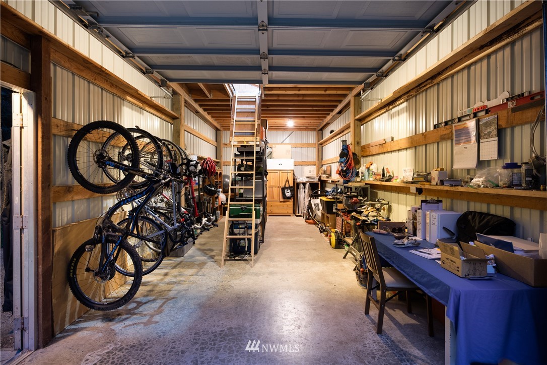 3625 Green Cliffs Road Anacortes, WA 98221 - Photo 24 of 26 a view of a storage area with racks on the wall