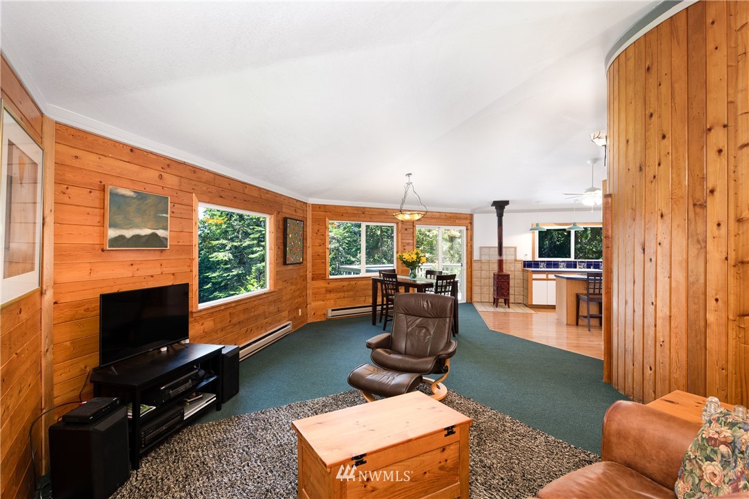 3625 Green Cliffs Road Anacortes, WA 98221 - Photo 9 of 26 a living room with furniture fireplace and flat screen tv