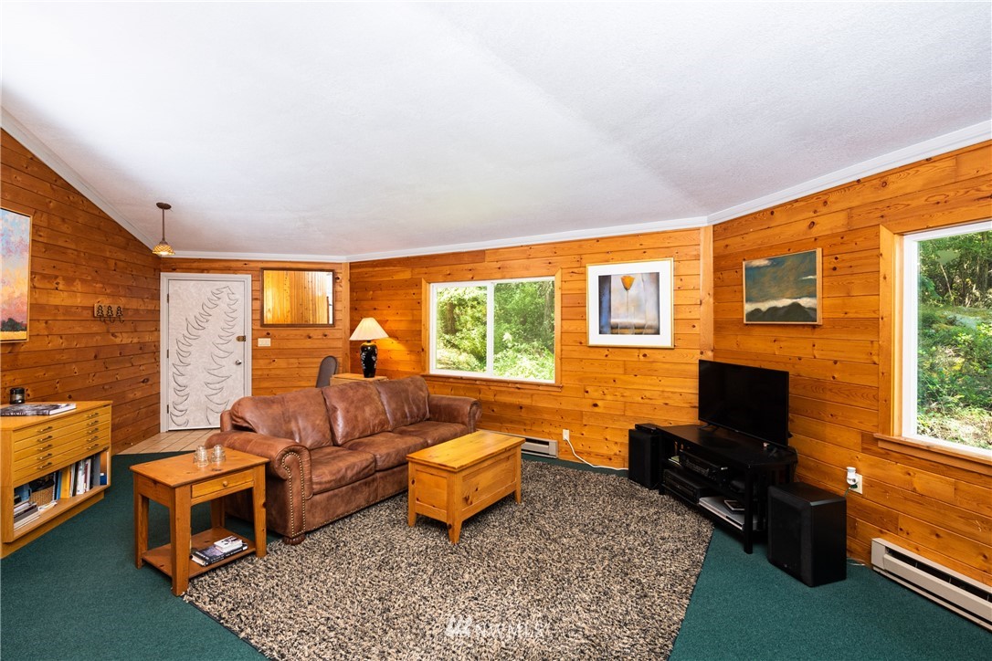 3625 Green Cliffs Road Anacortes, WA 98221 - Photo 10 of 26 a living room with furniture and a flat screen tv