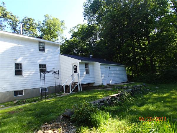 100 Cordaville Road Ashland, MA 01721 - Photo 2 of 11 a view of a house with a yard and a large tree