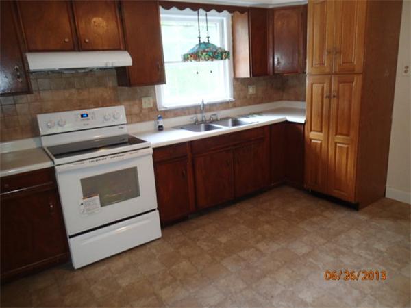 100 Cordaville Road Ashland, MA 01721 - Photo 3 of 11 a kitchen with a stove sink and cabinets