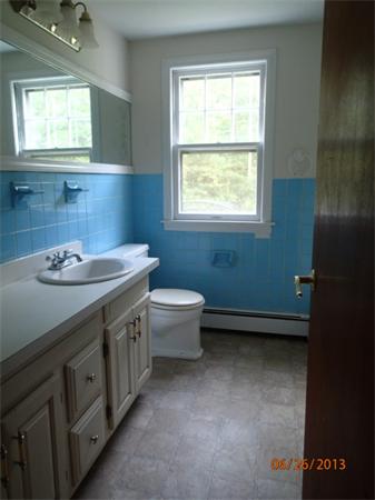100 Cordaville Road Ashland, MA 01721 - Photo 4 of 11 a bathroom with a sink a toilet and a window