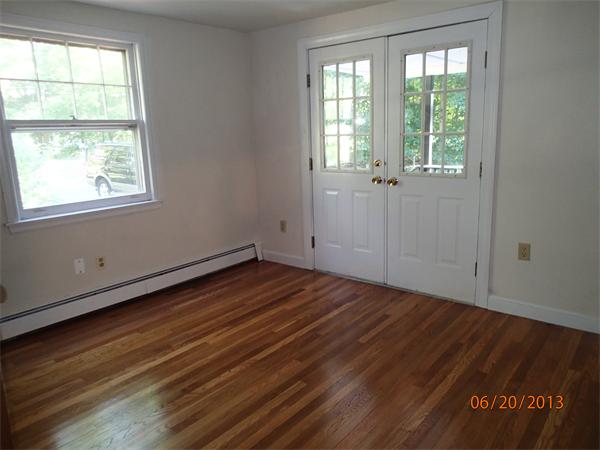 100 Cordaville Road Ashland, MA 01721 - Photo 7 of 11 an empty room with wooden floor and windows