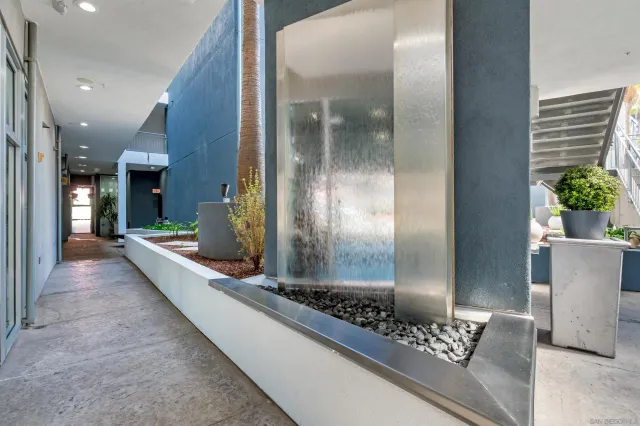 a view of a patio with couches and potted plants