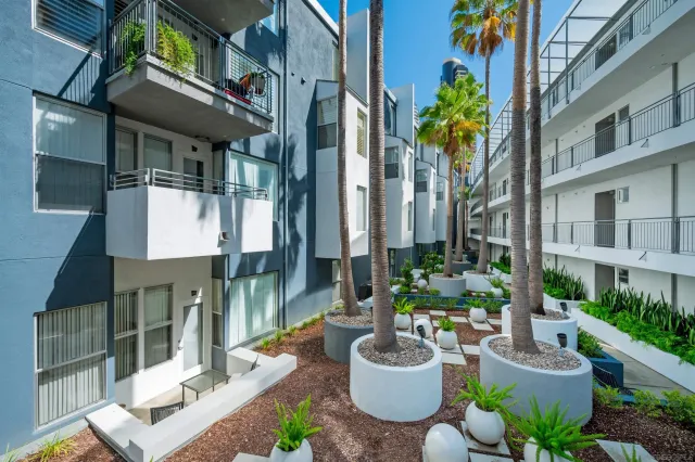 a view of house with outdoor seating and city view