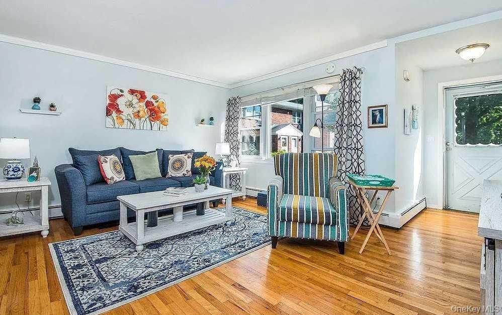 2710 South Road, Unit F11 Poughkeepsie, NY 12601 - Photo 2 of 10 a living room with furniture and a table